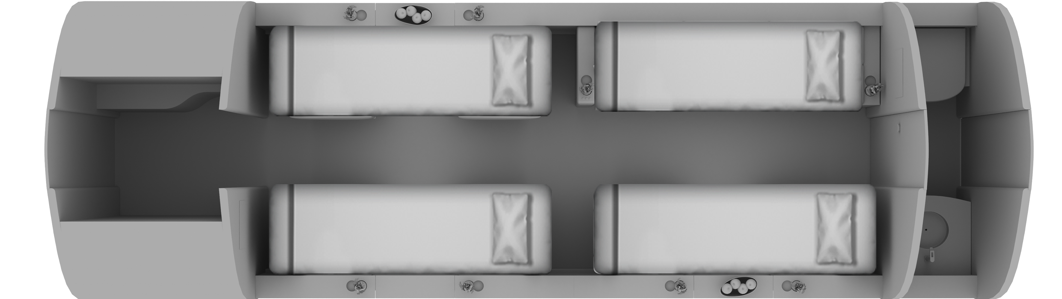 An overhead diagram of an aircraft cabin layout with four bed-like seating arrangements and a rear lavatory.